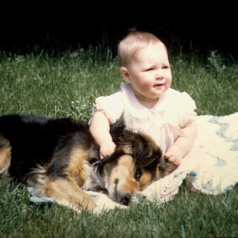 Stephanie Gibeault as a baby with a dog